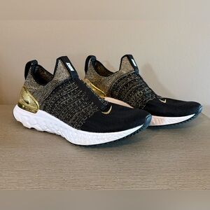 Nike Women's Black & Gold React Phantom Run Flyknit 2 Premium sneakers